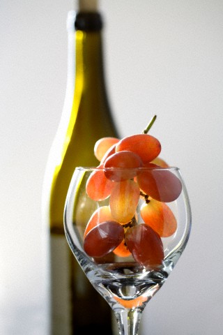Grapes in wine glass