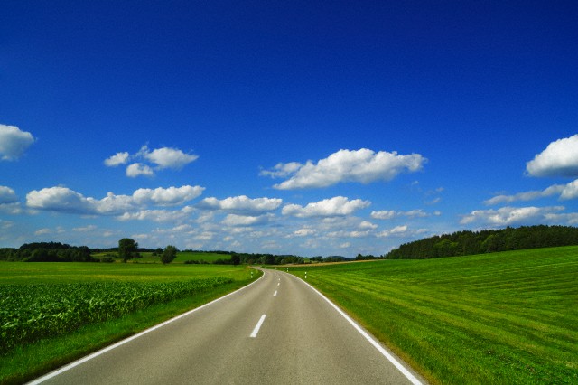 Countryside street and cumulonimbus clouds